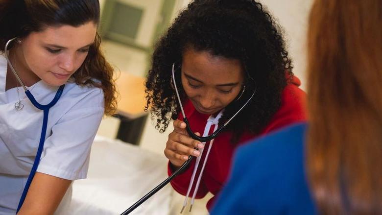 Nurses checking a patient